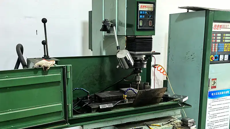 High-precision EDM machine for custom medal mold making at Arliven